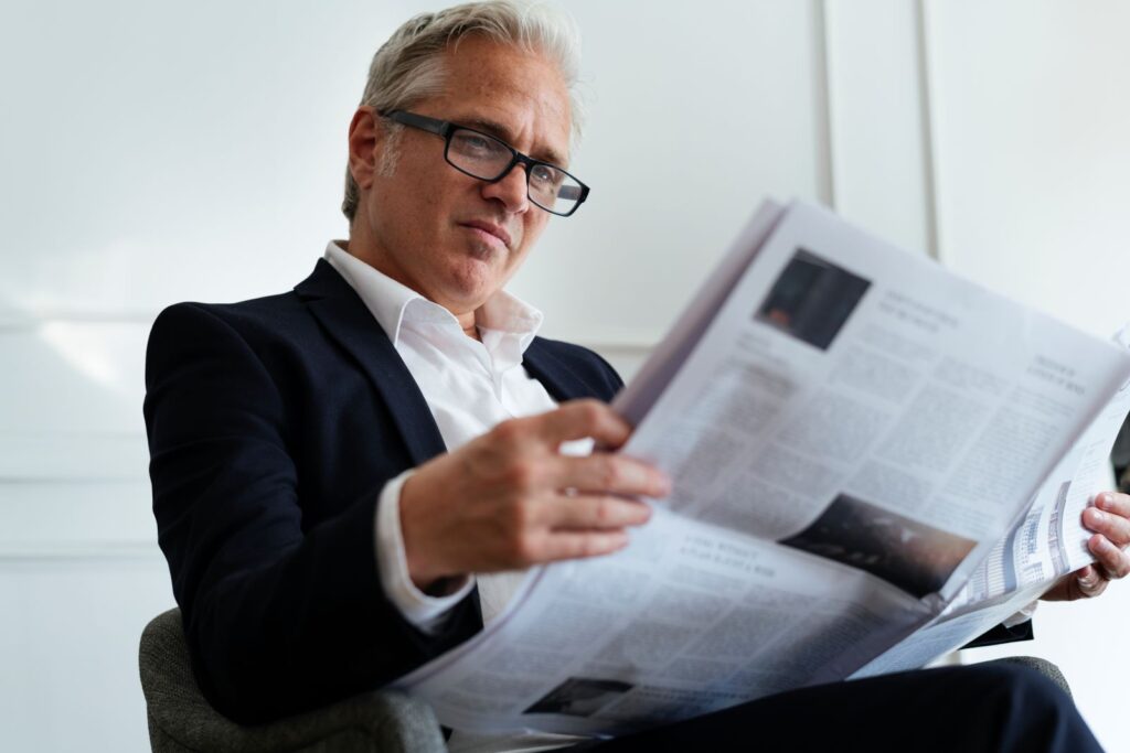 businessman reading the news 2022 12 16 00 38 23 utc1600